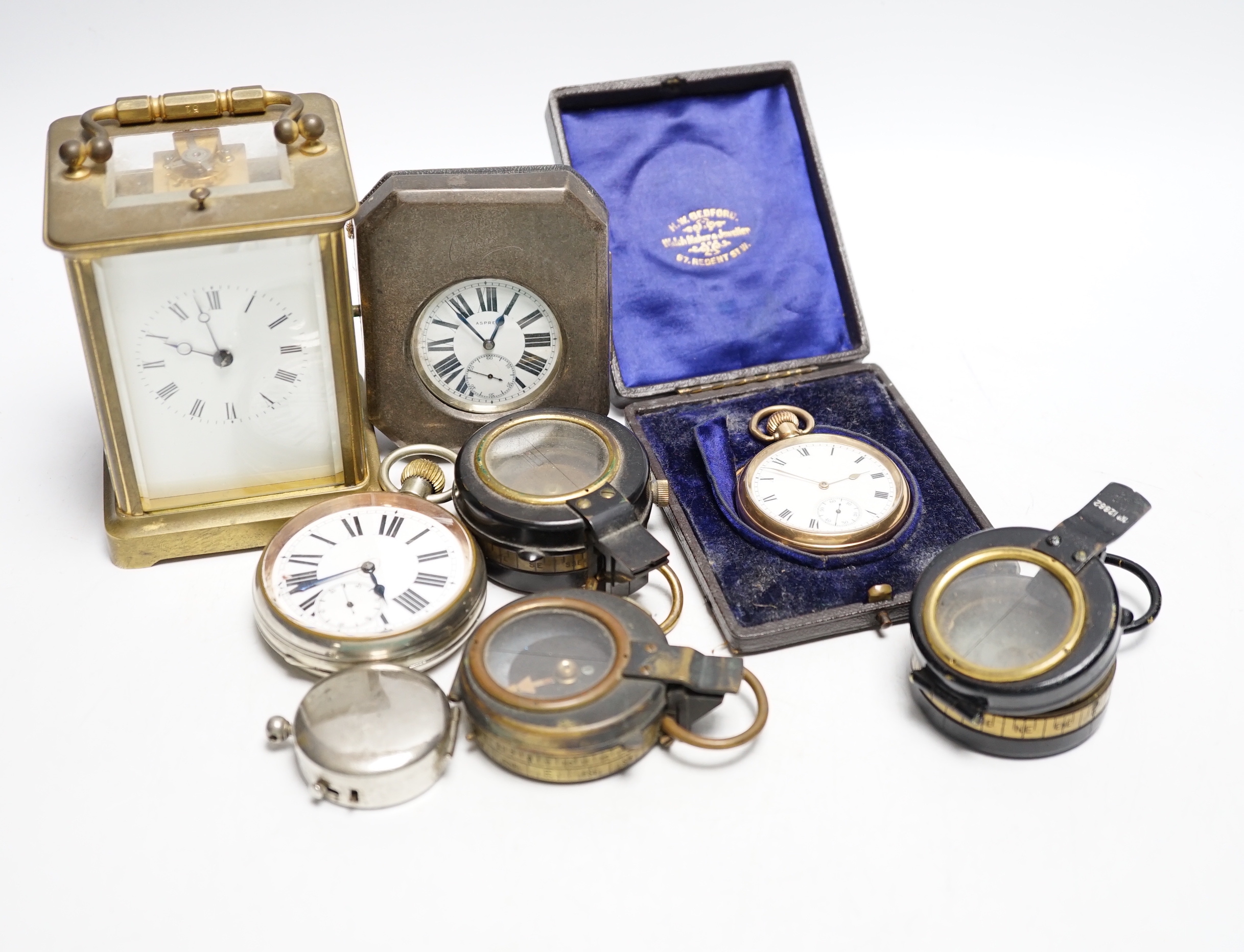 An Asprey pocket watch in silver mounted case, brass cased carriage timepiece, military compasses etc.